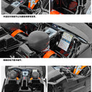 Close-up of a vehicle's interior with dashboard and steering wheel, featuring electronic components.