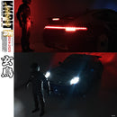 Two images of a car with its headlights on and a person standing next to it, one in red lighting and the other in black and white.