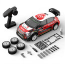 MJX 10303 Model car kit with remote control, wheels, and tools on a white background